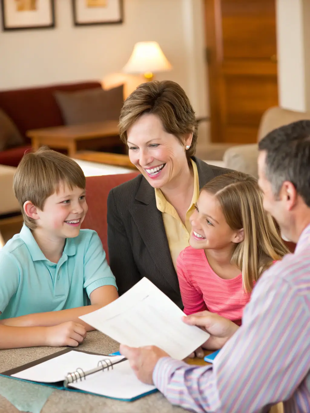 An image of a family discussing finances with a consultant in a bright, modern office, representing personal financial planning.